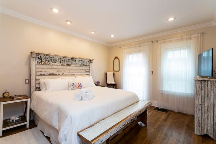 The Waylon & Jessi master bedroom on the first floor features a king-size bed with  custom-made furniture and Roku enabled TV. 