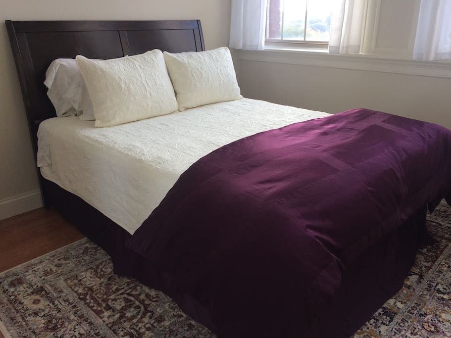 Comfy queen-sized guest bed