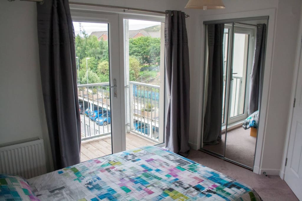Double bed with fitted wardrobe and storage.