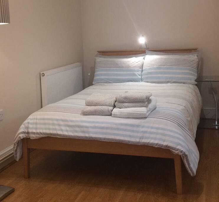 Double bedroom with large wardrobe, hangers, hairdryer