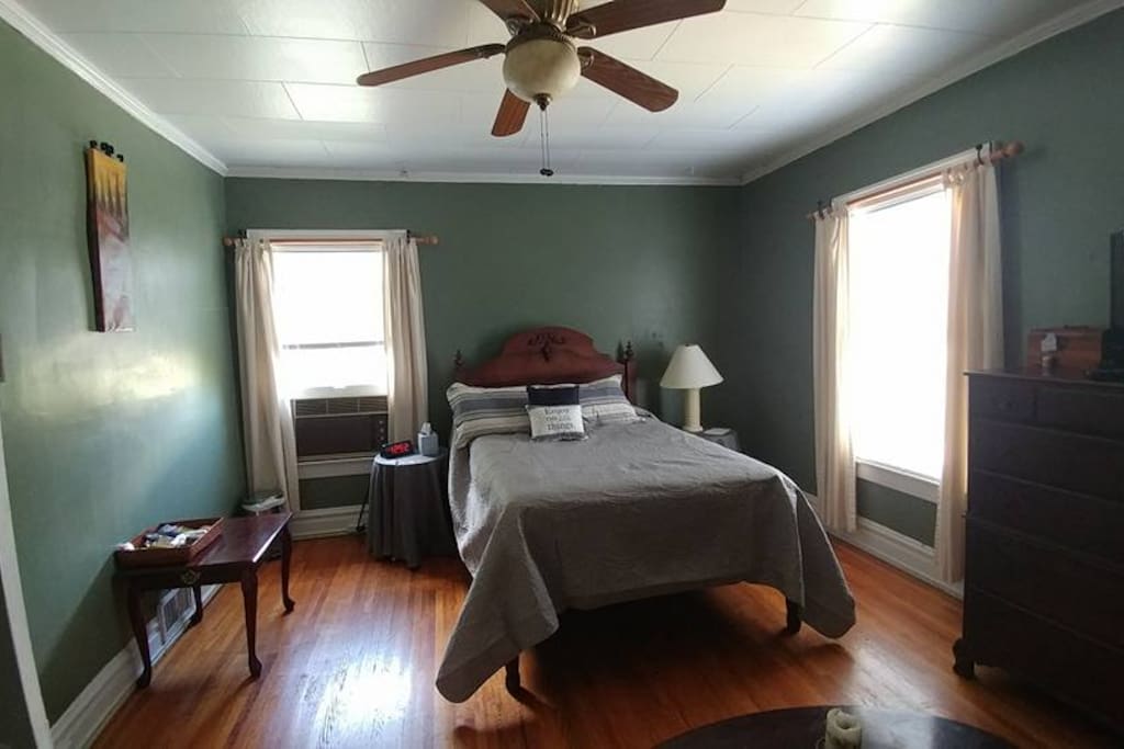 The Master Bedroom; original hardwoods, antique bed from my grandparent's farm; cherry wood accents