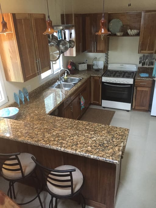 Large kitchen with breakfast bar.