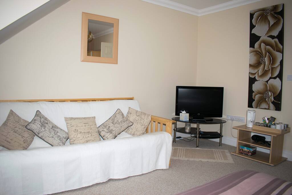 Sunshine bedroom with sofa