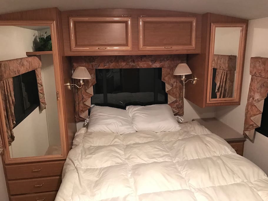 Full size bed in the master bedroom.