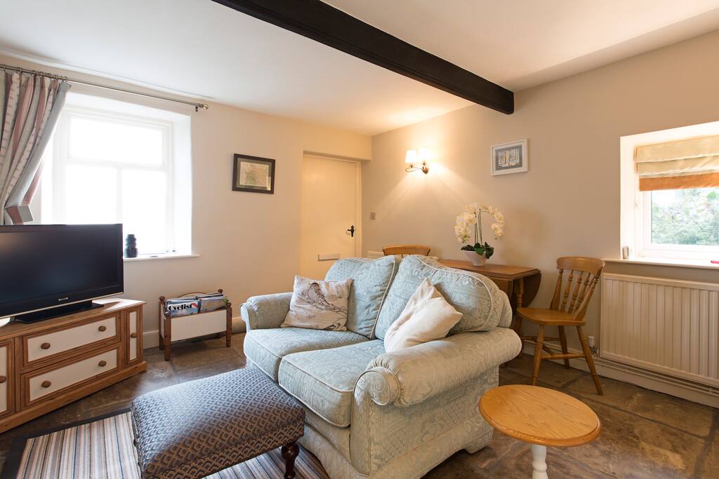 Our cosy and sweet lounge with log burning stove.