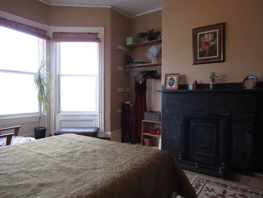 Bedroom-showing fireplace, bay window