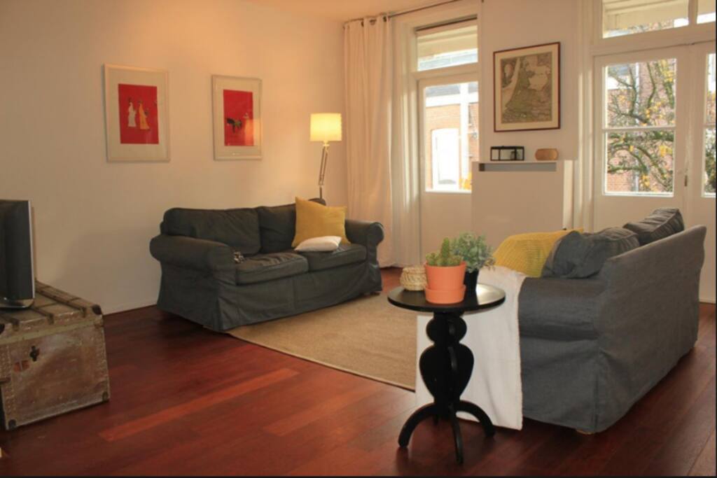 The spacious living room, with a comfortable couch