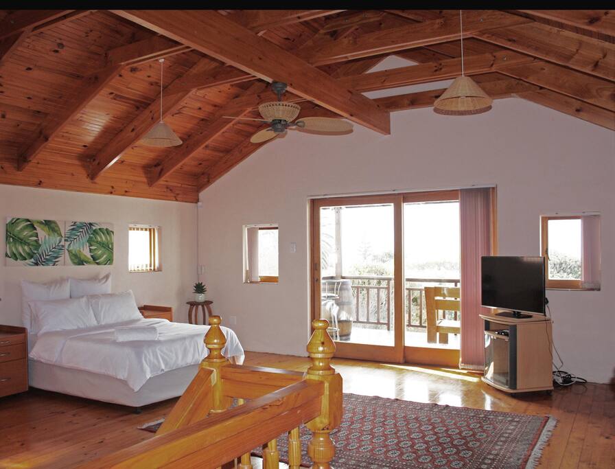 The main loft room with sea view, private full bathroom and flat screen television.