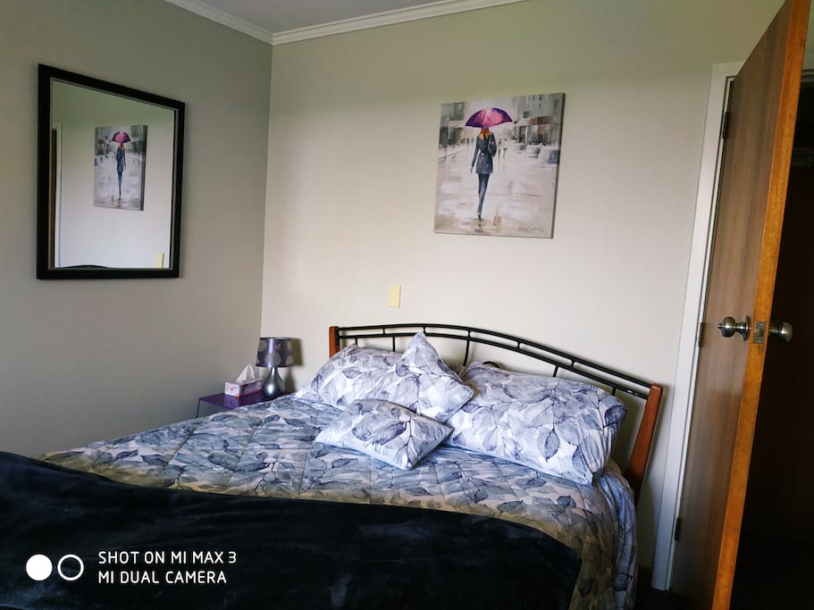 Bedroom has a queen size bed