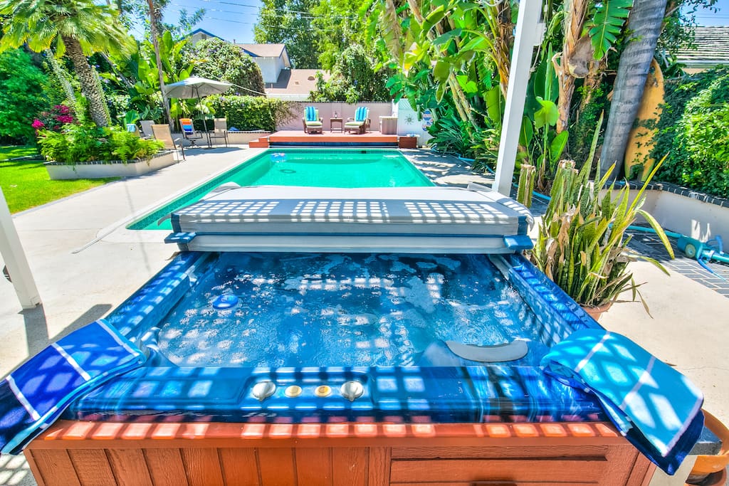 Tranquil backyard with pool and hot tub