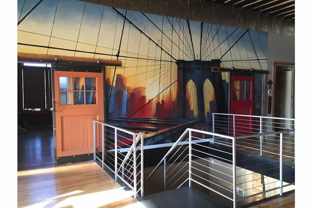 Hand painted wall by family friend. Brooklyn bridge at sunrise/sunset ... Not sure :)