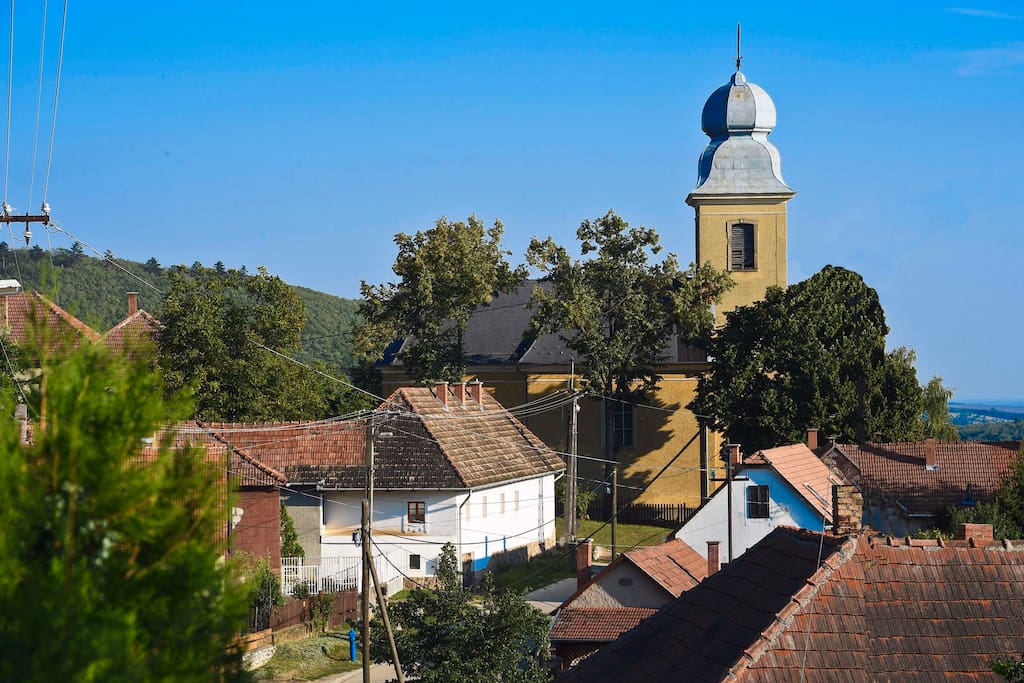 Street view - The Bell House on the left and the catholic church in the back