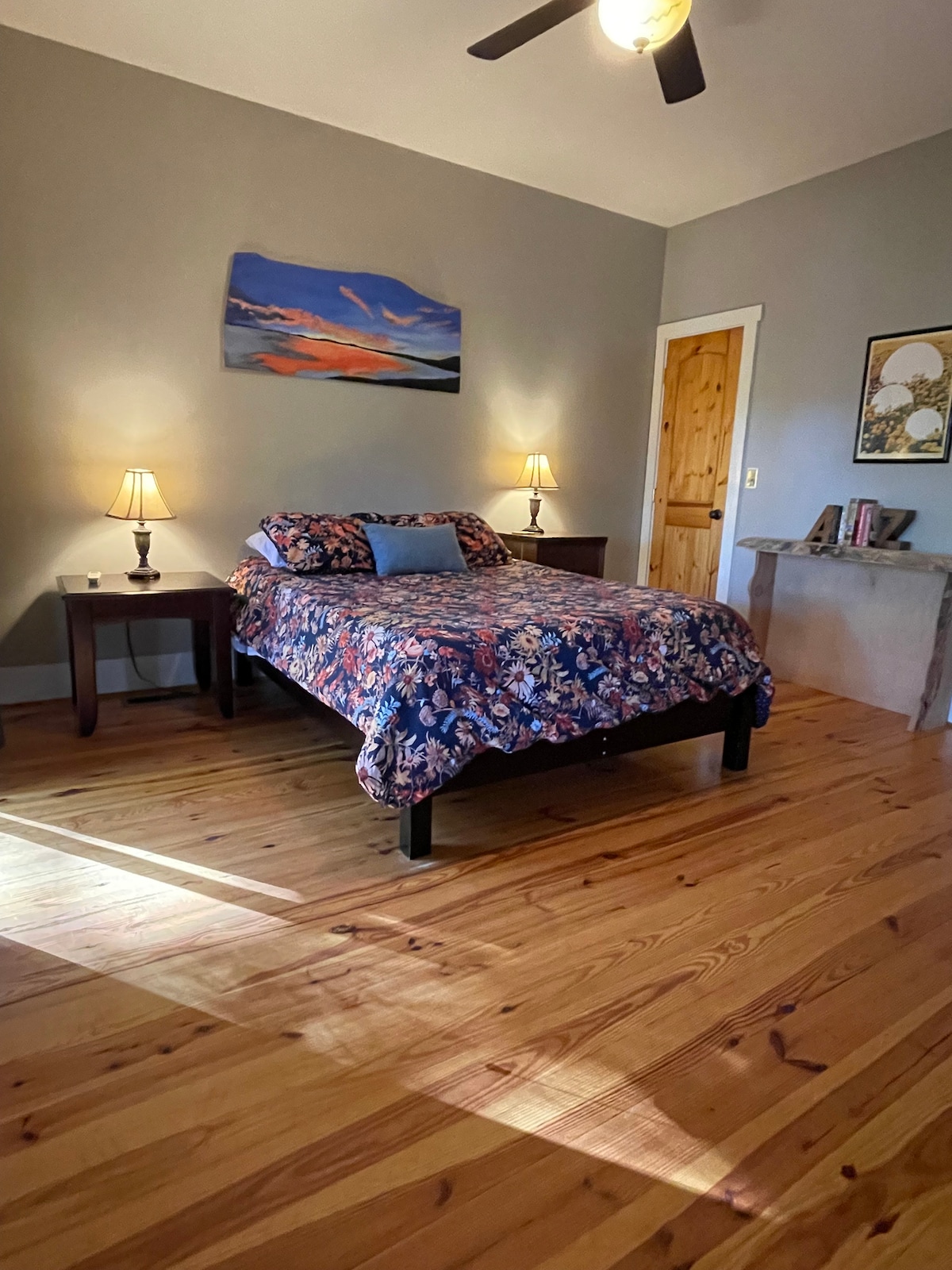 downstairs master bedroom with lakeview, queen bed