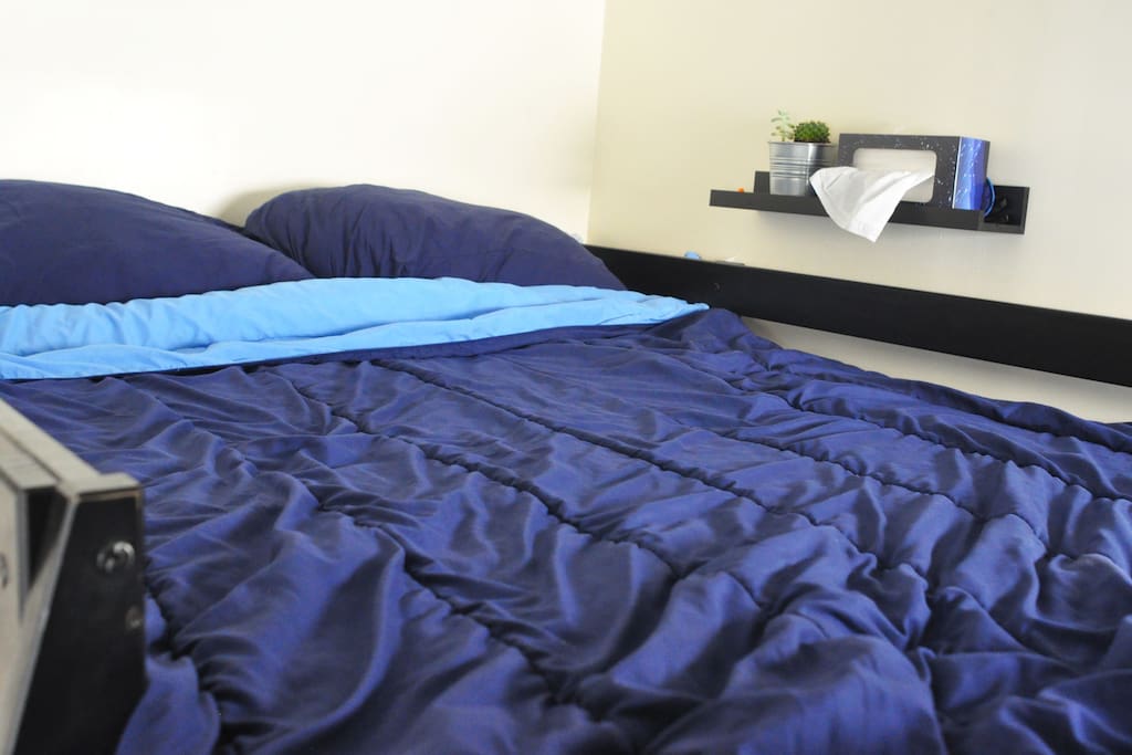 Comfy loft bed with a handy bed-side shelf