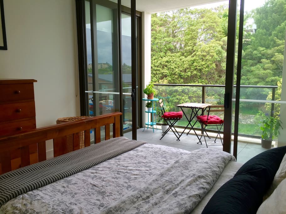 Bedroom with closet and sliding door to balcony