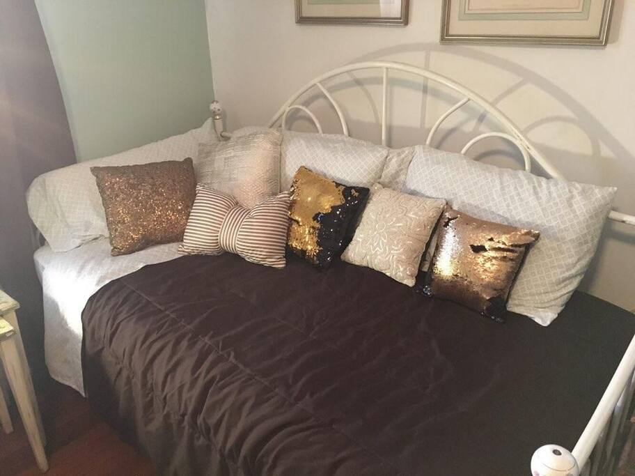 This room features a twin bed and a king sized bed (which can also be switched for two twins). The room is comfortable and spacious with available dressers, closet space, TV, desk and a full private bathroom in the room.