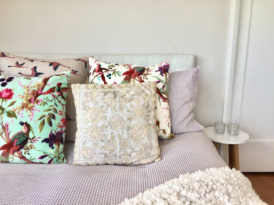 Cozy double bed with bedside tables