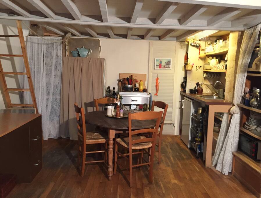 dining table and the ladder to go to the sleeping area ( the mezzanine)