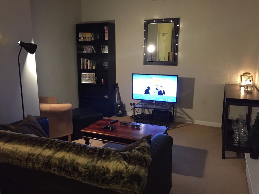 Trendy living room with a side bar area.