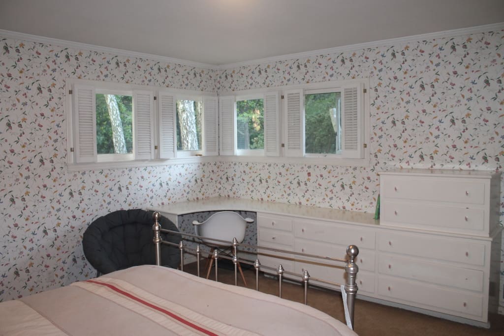 Light Filled room with desk and plenty of storage space.