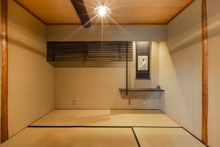 Central bedroom (4.5 tatami size), restored from the original guest room. Two persons can sleep here on futon (Airbnb certified photographer).