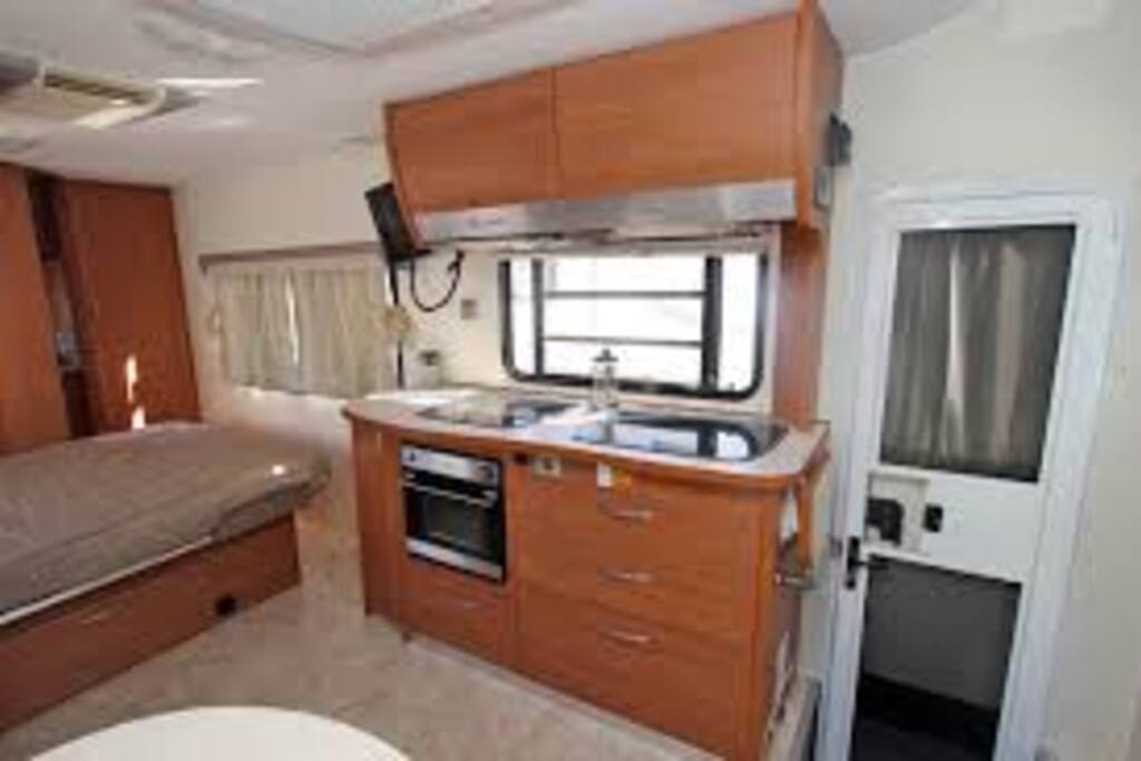 Well equipped kitchen with oven, hotplates and microwave oven