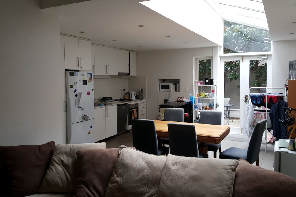 Large open large kitchen and living room leading to the courtyard