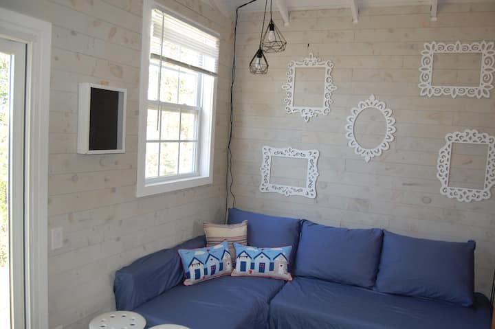 Comfy seating area, couch pulls out to a double bed (linens upon request for an additional fee).