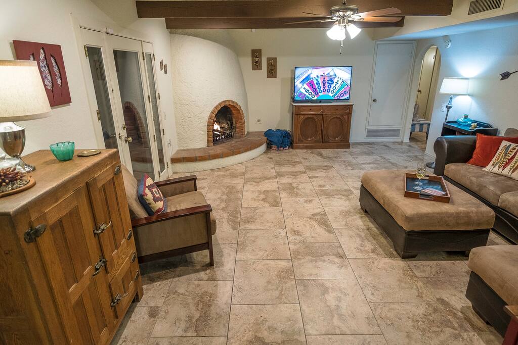 Family Room with gas fireplace and large sectional (couch that sleeps one and air mattress that sleeps two)
