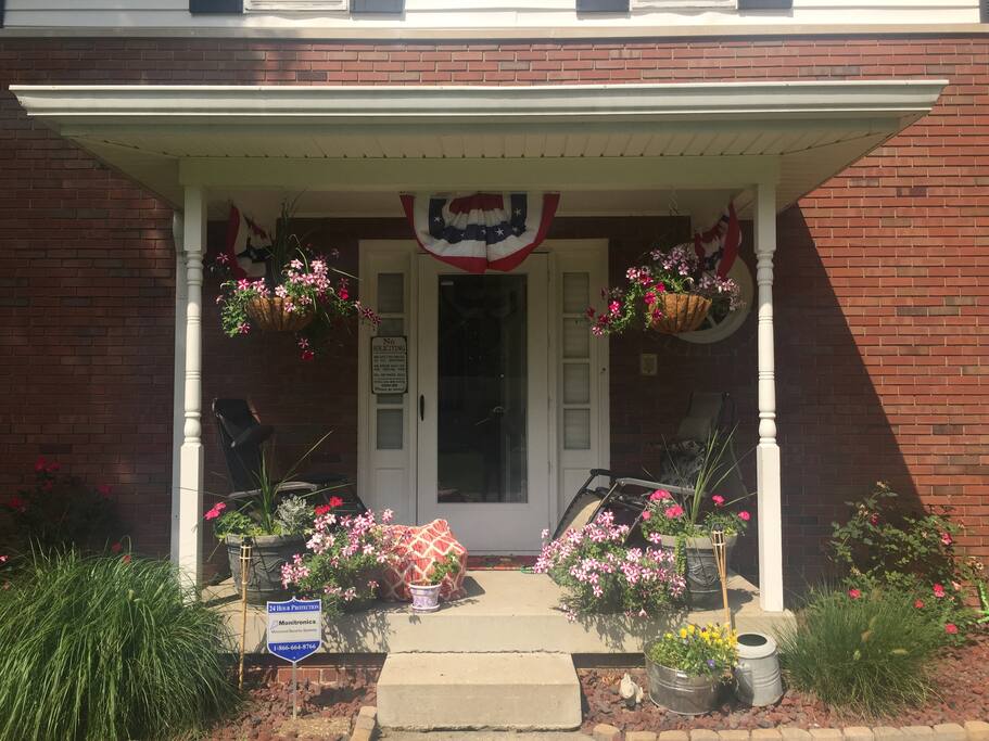 Front porch with chairs to relax.