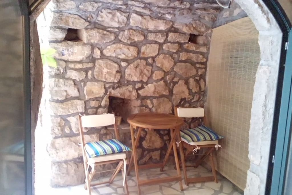 In front of the Cave where you can enjoy deep shade during hot Summer months