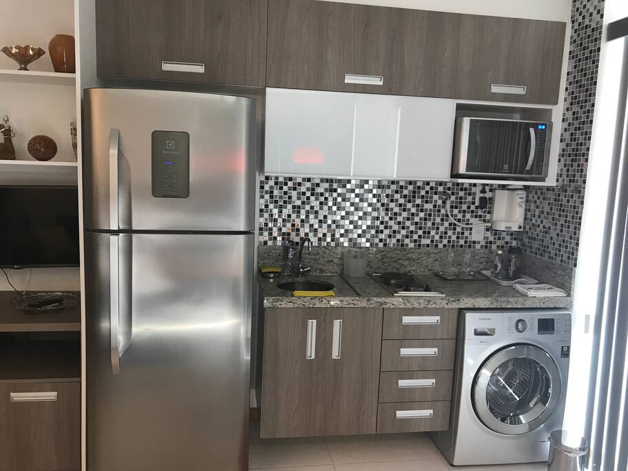 Brand new, stainless steel appliances in well equipped kitchen