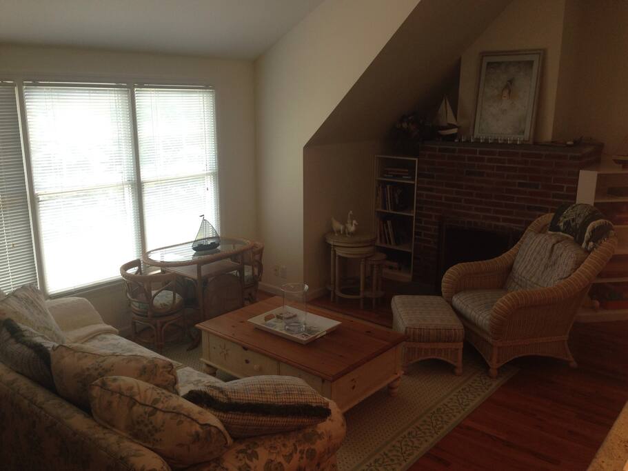 Lounge Area with beautiful water views, Ethan Allen decor, and a romantic fireplace.