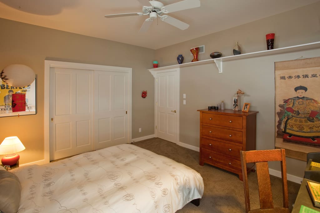 View of closet and dresser
