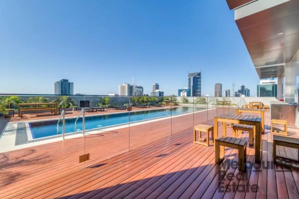 Lounging area at rooftop pool of my apartment. Photo credit: Melbourne Real Estate