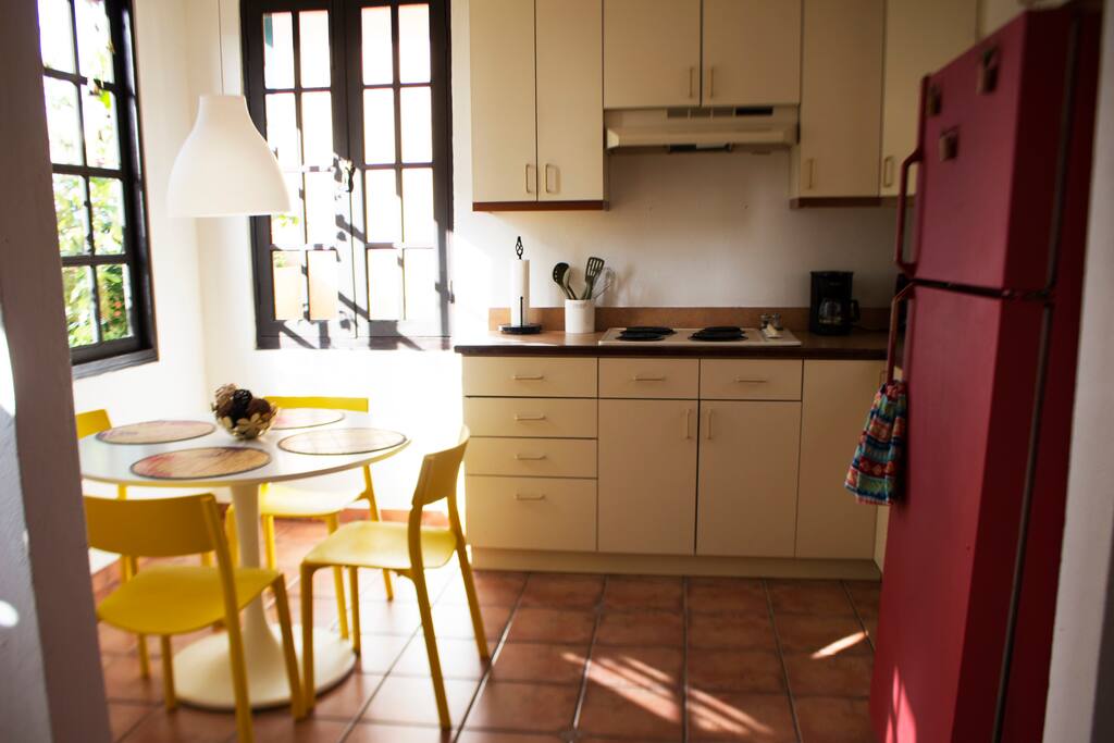 Sunset light bathing the dining room and kitchen area.