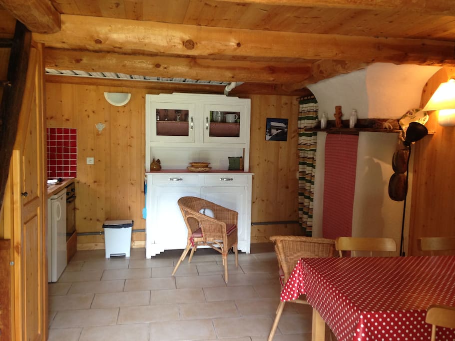 The main room from the entrance (kitchen corner on your left, fire place and table on the right)