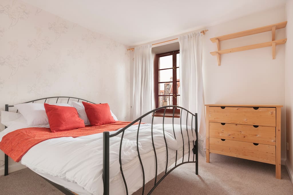 Bedroom with memory foam topped bed, wardrobe and drawers