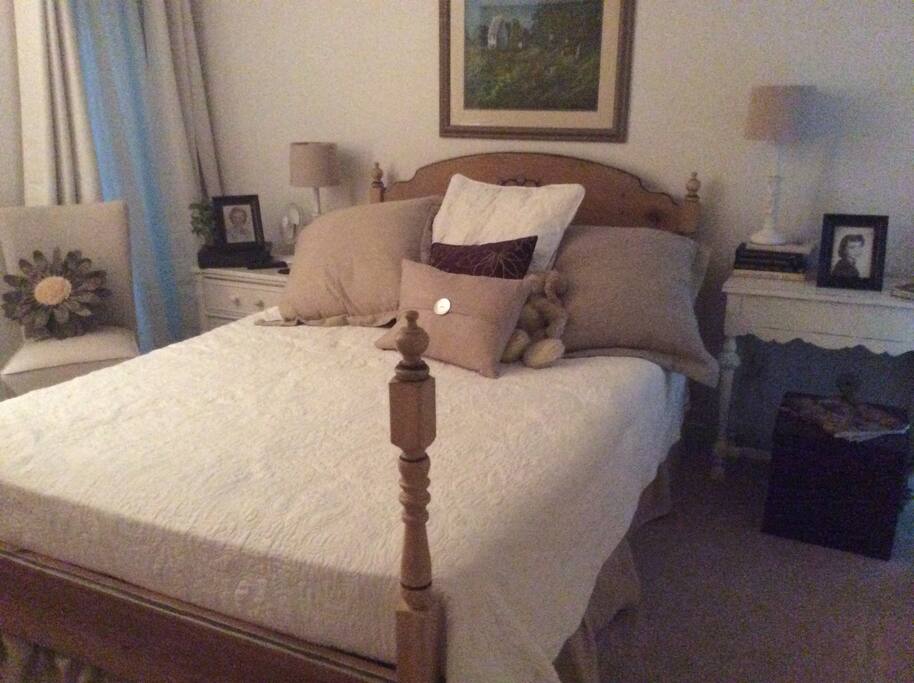 Comfy bed. Flat screen on wall.