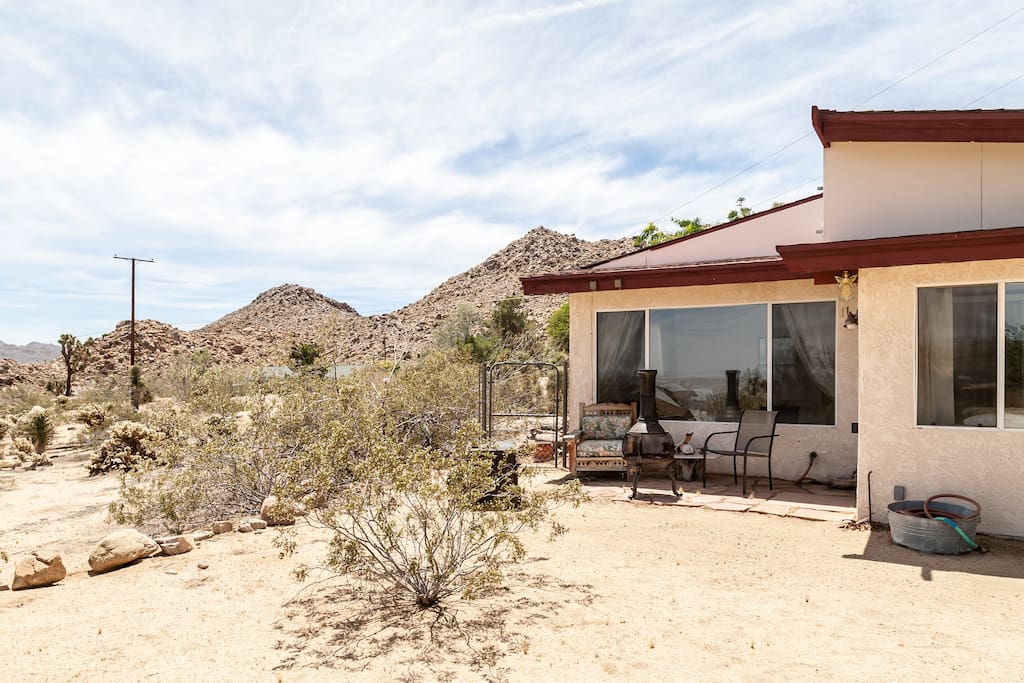 Backyard behind the bedroom and it's sunroom.