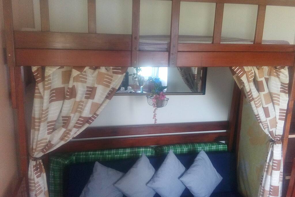 Besides the master bedroom, there is a loft with two levels. The bottom of the loft has a twin size sofa bed while the top has a single bed.