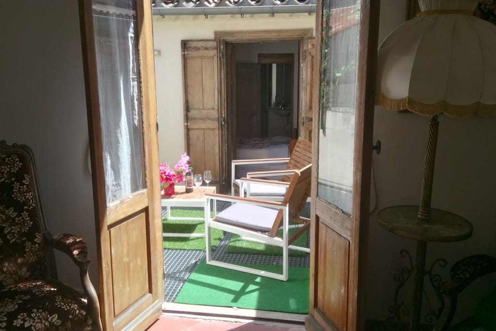 Cozy den/salon with sofa is next to the terrace as well.
