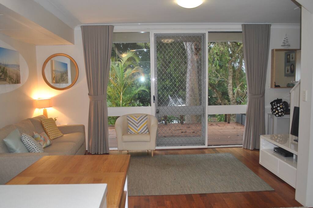 Open plan living/dining with sliding door access to deck and garden