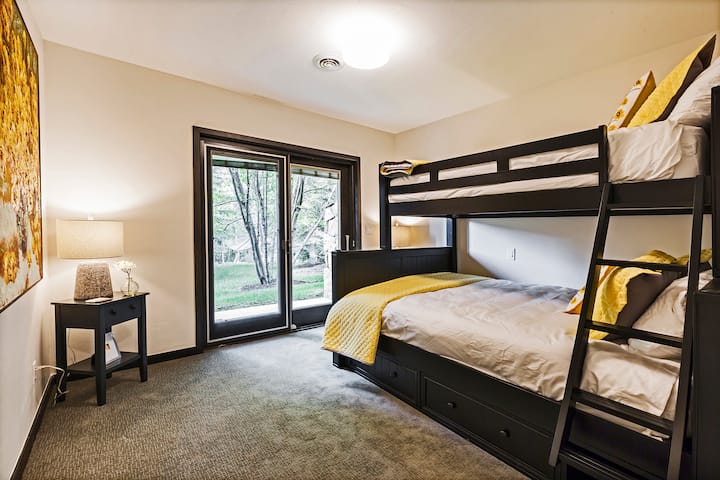 There is room for three in this superior quality twin/queen bunk bed with en suite bathroom. Plus, the bedroom has walk-out access.