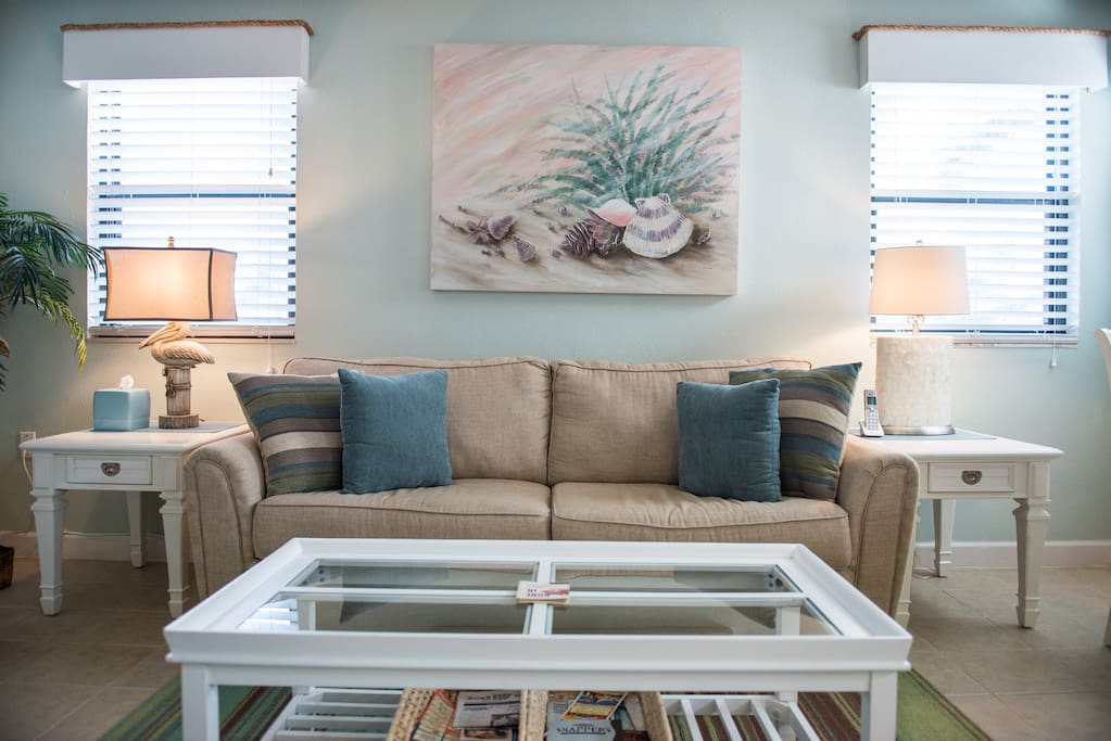 Lots of natural sunlight in this coastal inspired living area.