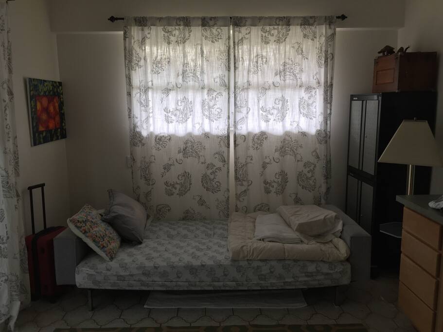 Sea Shell Cottage with the bed made.