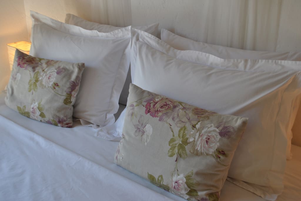 Comfortable king-size beds with fresh, white linen.