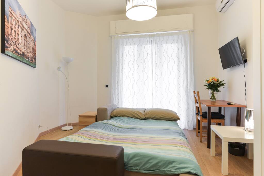 Dining room with 2 people: Sofa bed open in dining room with tv, air con...