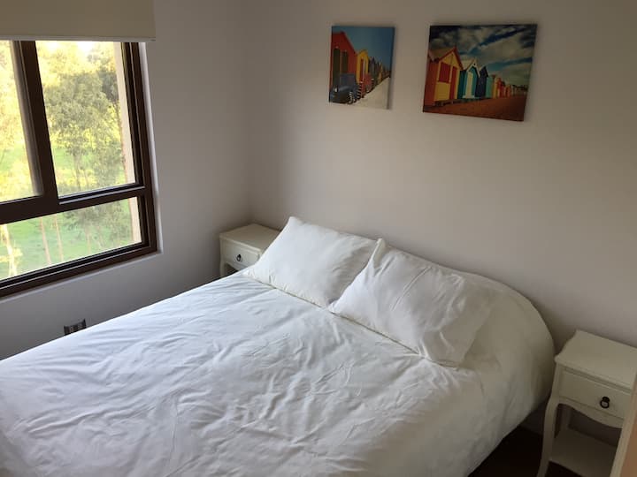 Second bedroom with view to the hill and bed for 2 people.