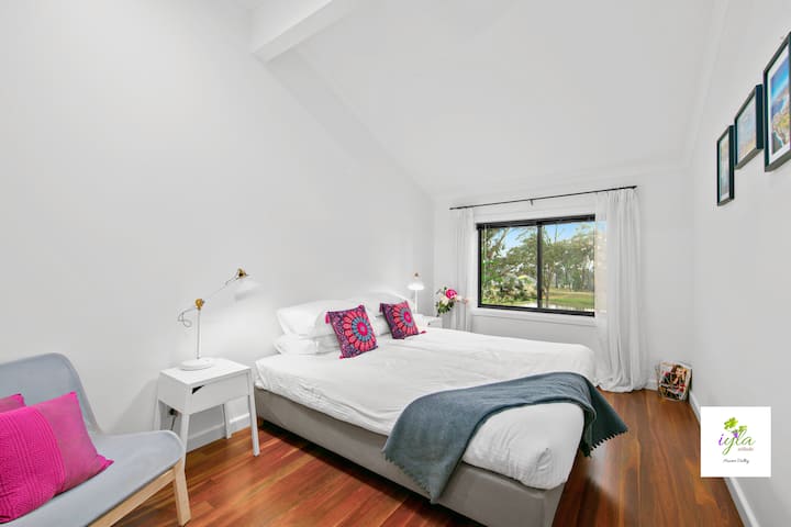 Downstairs Bedroom 1 with king bed & dam view